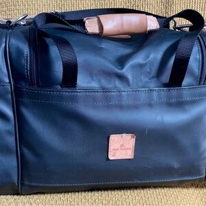 Jon Hart Black and Tan Duffel Bag